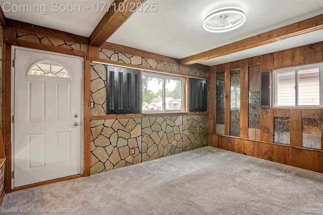 7536 Arcola St, Westland, MI 48185 - foyer entrance featuring wood walls, beamed ceiling, and carpet floors