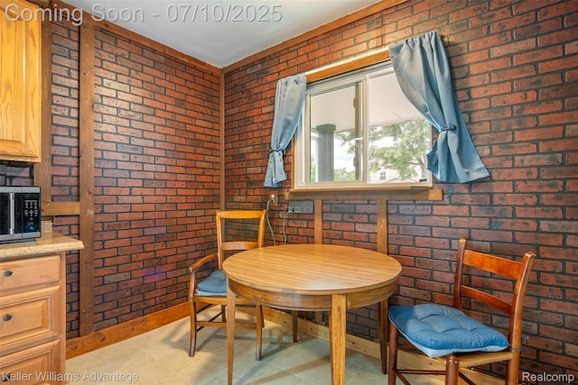 7536 Arcola St, Westland, MI 48185 - dining area with brick wall and light floors