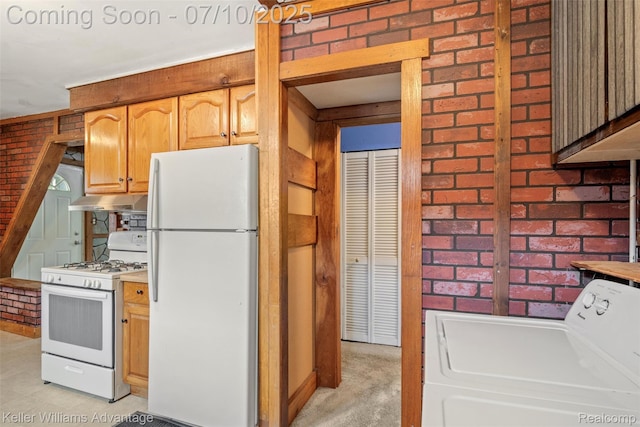 7536 Arcola St, Westland, MI 48185 - kitchen with white appliances, washer / dryer, under cabinet range hood, brick wall, and light countertops