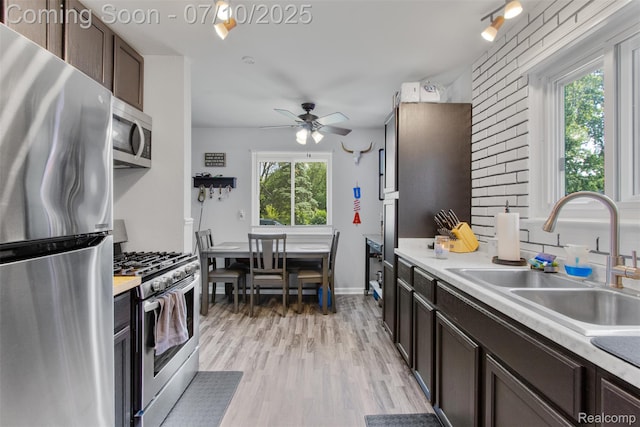 6336 Glenis St, Taylor, MI 48180 - kitchen featuring stainless steel appliances, healthy amount of natural light, and light countertops