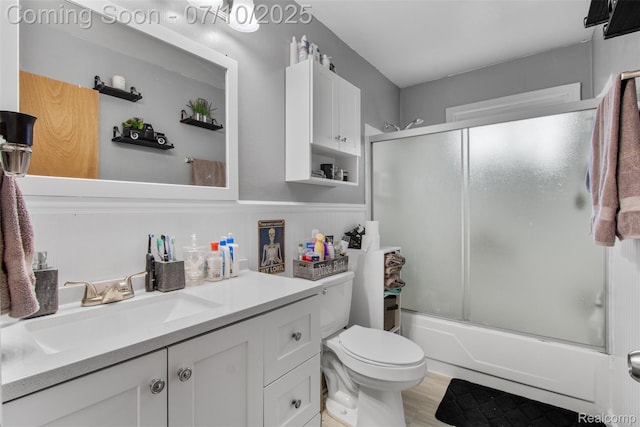 6336 Glenis St, Taylor, MI 48180 - full bath with vanity, combined bath / shower with glass door, and wainscoting