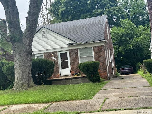 9311 Fielding St, Redford, MI 48228 - view of front of home with driveway, roof with shingles, and brick siding