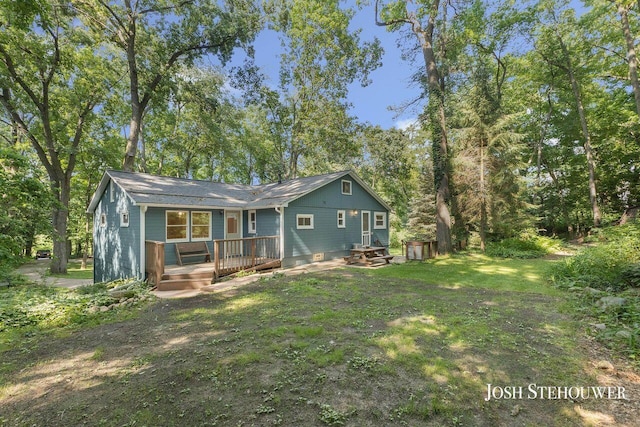 678 Pierce Rd, Plainwell, MI 49080 - rear view of property with a deck and a yard