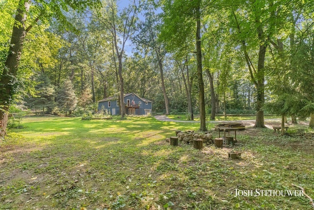 678 Pierce Rd, Plainwell, MI 49080 - view of grassy yard with a forest view