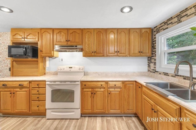 678 Pierce Rd, Plainwell, MI 49080 - kitchen featuring electric stove, black microwave, under cabinet range hood, light wood-style floors, and recessed lighting