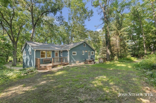 678 Pierce Rd, Plainwell, MI 49080 - back of house featuring a wooden deck and a yard
