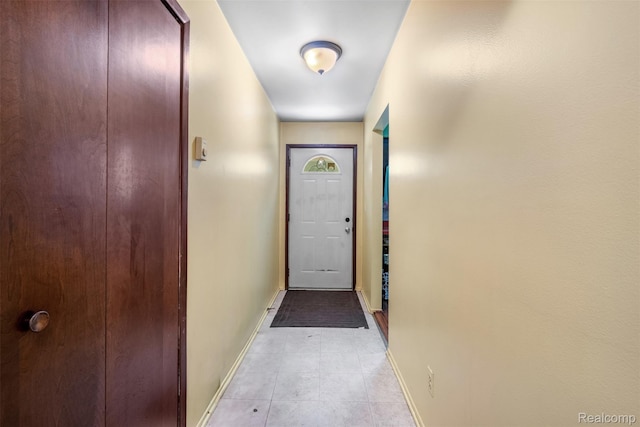 2650 N Lake George Rd, Metamora, MI 48455 - doorway to outside with baseboards and light tile patterned floors
