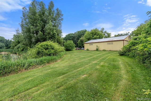 2650 N Lake George Rd, Metamora, MI 48455 - view of green lawn with a pole building and an outbuilding