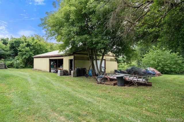 2650 N Lake George Rd, Metamora, MI 48455 - view of green lawn with a pole building, an outbuilding, and a detached garage