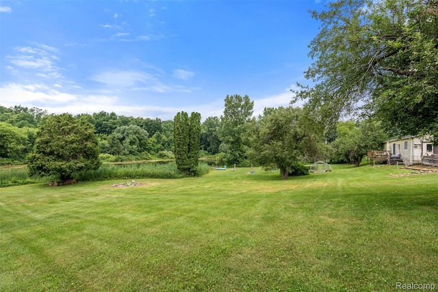 2650 N Lake George Rd, Metamora, MI 48455 - view of grassy yard with a wooden deck