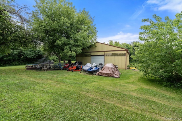 2650 N Lake George Rd, Metamora, MI 48455 - view of green lawn featuring a garage and an outbuilding