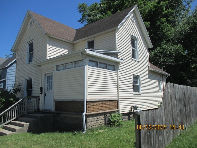 112 E Green St, Hastings, MI 49058 - view of side of home with a shingled roof