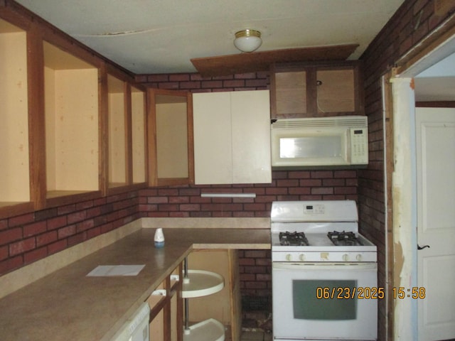 112 E Green St, Hastings, MI 49058 - kitchen featuring white appliances and decorative backsplash