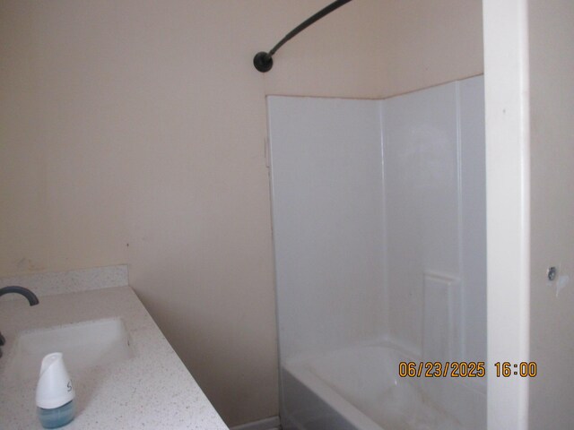 112 E Green St, Hastings, MI 49058 - bathroom with vanity and shower / bathtub combination