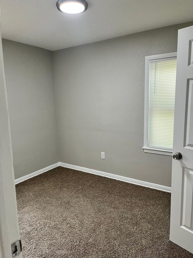 20174 San Juan Dr, Detroit, MI 48221 - carpeted empty room with baseboards