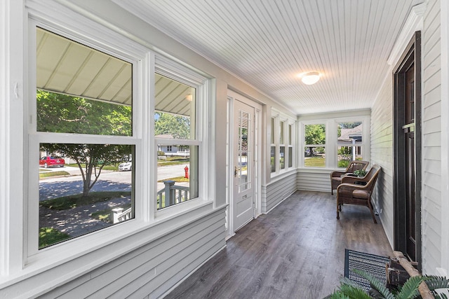 412 N Robert St, Ludington, MI 49431 - sunroom featuring wood finished floors and crown molding