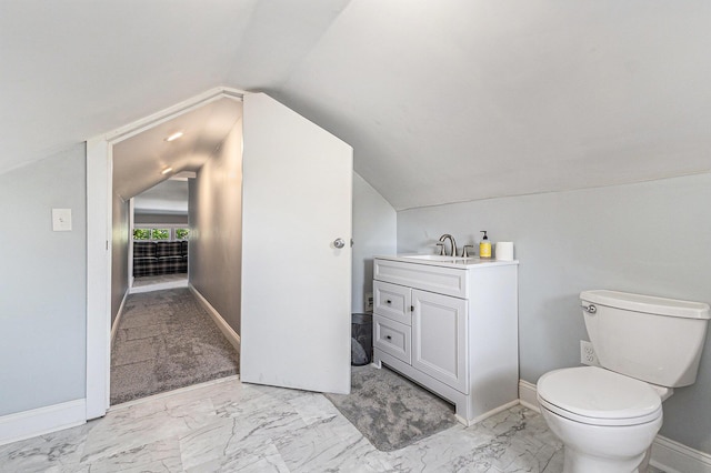 412 N Robert St, Ludington, MI 49431 - half bathroom featuring vanity, marble finish floors, and lofted ceiling