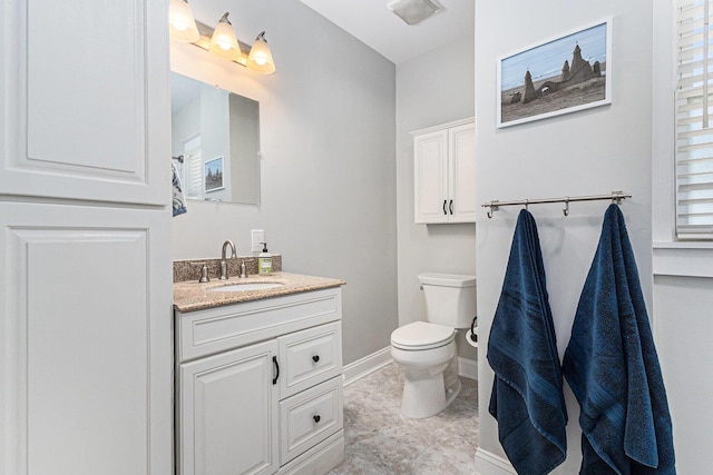 412 N Robert St, Ludington, MI 49431 - bathroom featuring toilet and vanity