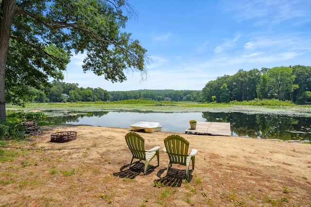 630 N 2nd St, Kalamazoo, MI 49009 - water view featuring an outdoor fire pit and a heavily wooded area