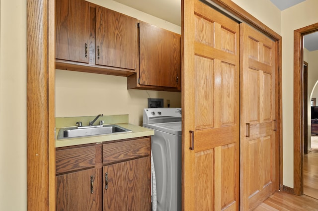 630 N 2nd St, Kalamazoo, MI 49009 - washroom with cabinet space, washer / dryer, and light wood-type flooring