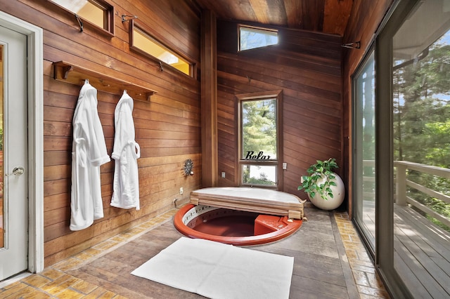 630 N 2nd St, Kalamazoo, MI 49009 - bathroom featuring wooden walls, plenty of natural light, a tub, and wood ceiling