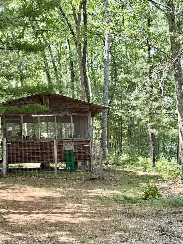 17924 Round Lake Rd, Wellston, MI 49689 - view of poultry coop featuring a forest view