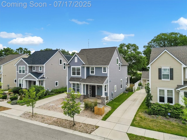 482 Wilson St, Ferndale, MI 48220 - traditional-style house with a porch, concrete driveway, a residential view, and a shingled roof