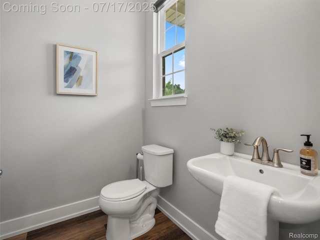 482 Wilson St, Ferndale, MI 48220 - half bathroom featuring baseboards and wood finished floors