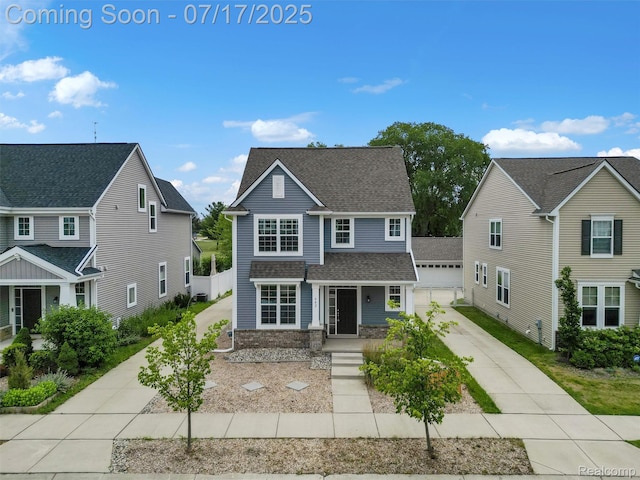 482 Wilson St, Ferndale, MI 48220 - traditional-style home with a shingled roof, a garage, concrete driveway, and covered porch