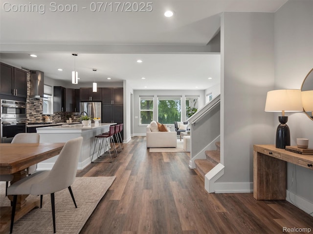 482 Wilson St, Ferndale, MI 48220 - dining area featuring dark wood-type flooring, stairs, and recessed lighting