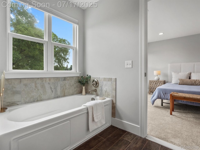482 Wilson St, Ferndale, MI 48220 - ensuite bathroom with a bath and wood finished floors