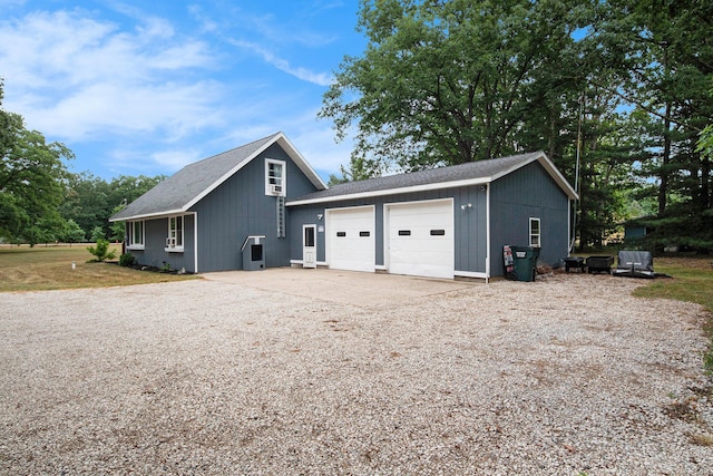 2430 140th Ave, Dorr, MI 49323 - view of property exterior with driveway and an attached garage