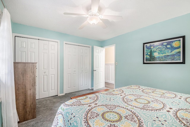 2430 140th Ave, Dorr, MI 49323 - bedroom featuring multiple closets, carpet, and ceiling fan