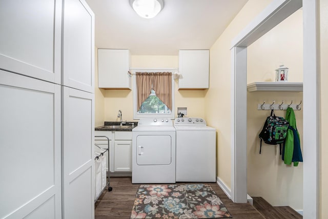 2430 140th Ave, Dorr, MI 49323 - washroom featuring cabinet space, washer and clothes dryer, and wood finished floors