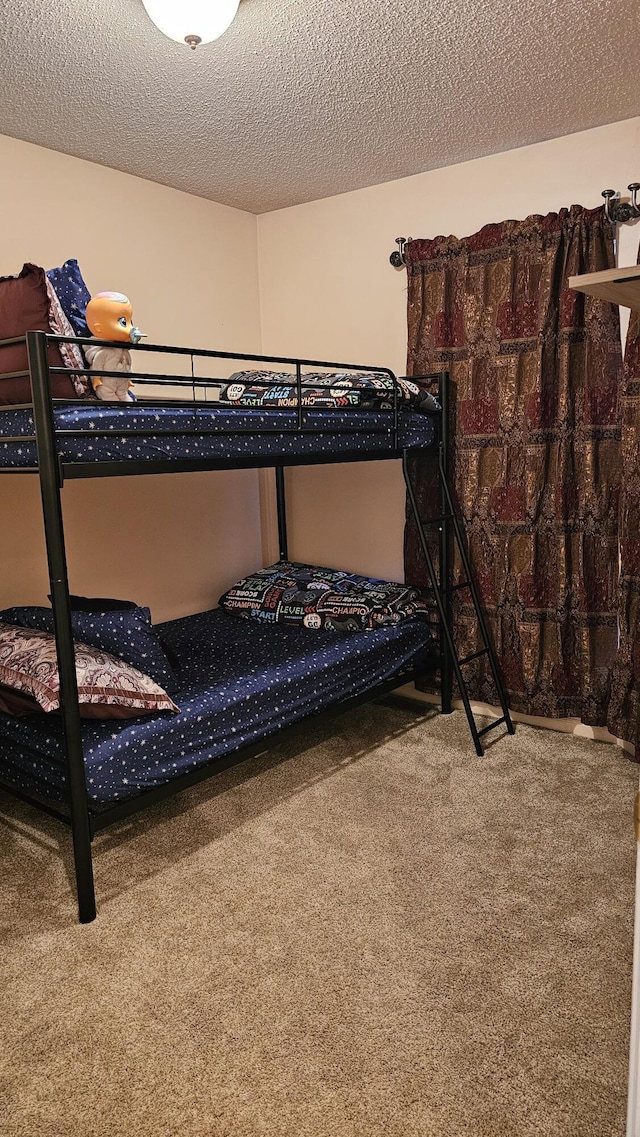 157 Carson Dr Unit 175, Westland, MI 48185 - carpeted bedroom featuring a textured ceiling