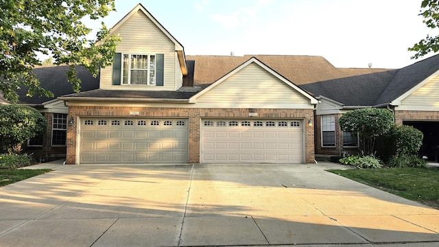 157 Carson Dr Unit 175, Westland, MI 48185 - traditional home with concrete driveway and brick siding