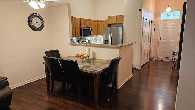 157 Carson Dr Unit 175, Westland, MI 48185 - dining area featuring a towering ceiling, dark wood-type flooring, and ceiling fan