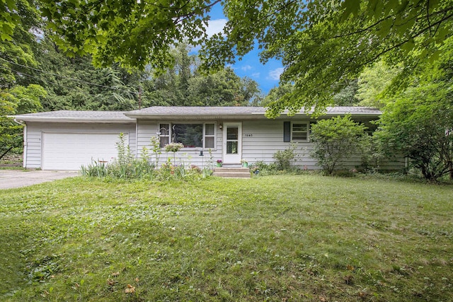 1560 G Ave W, Kalamazoo, MI 49009 - ranch-style house with an attached garage, a front lawn, and driveway