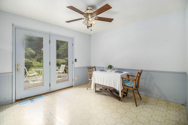 1560 G Ave W, Kalamazoo, MI 49009 - dining room with wainscoting, tile patterned floors, and ceiling fan