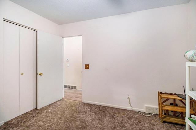 1560 G Ave W, Kalamazoo, MI 49009 - unfurnished bedroom featuring carpet and a closet