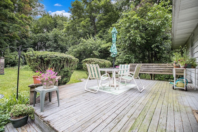 1560 G Ave W, Kalamazoo, MI 49009 - wooden terrace featuring outdoor dining space and a lawn
