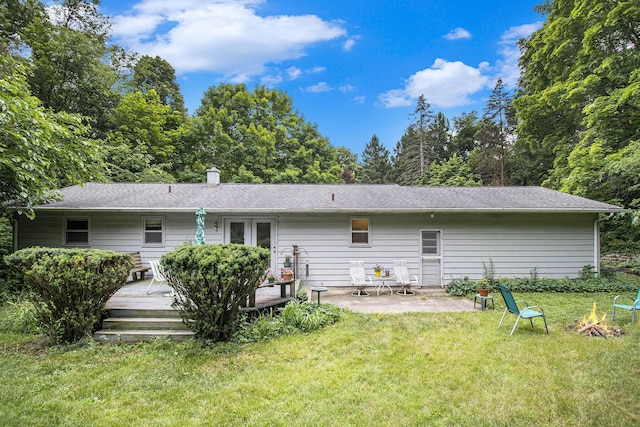 1560 G Ave W, Kalamazoo, MI 49009 - back of property with a yard, a deck, and a patio area