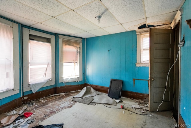 1525 Spruce St, Detroit, MI 48216 - spare room featuring a paneled ceiling and baseboards