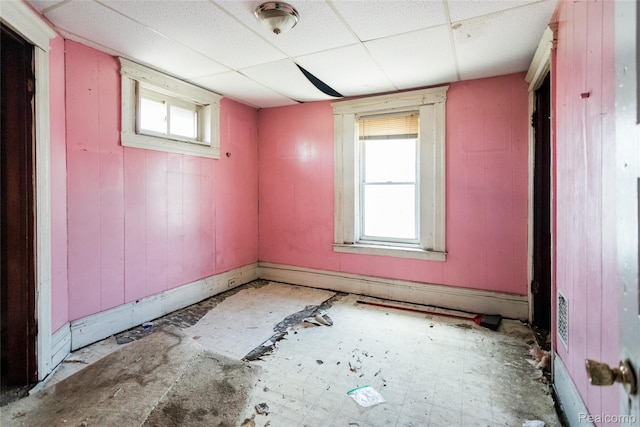1525 Spruce St, Detroit, MI 48216 - empty room with plenty of natural light and a paneled ceiling