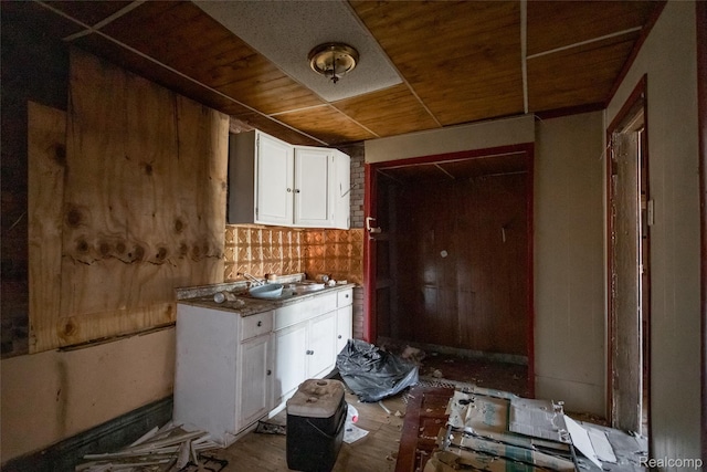 1525 Spruce St, Detroit, MI 48216 - kitchen with white cabinetry and wooden ceiling