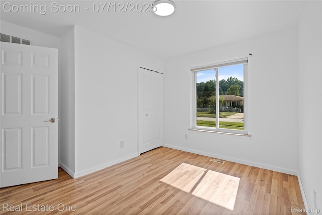 15679 Gulley St, Taylor, MI 48180 - unfurnished bedroom with wood finished floors and a closet
