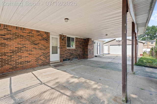 15679 Gulley St, Taylor, MI 48180 - view of patio / terrace featuring a garage, an outdoor structure, and a carport