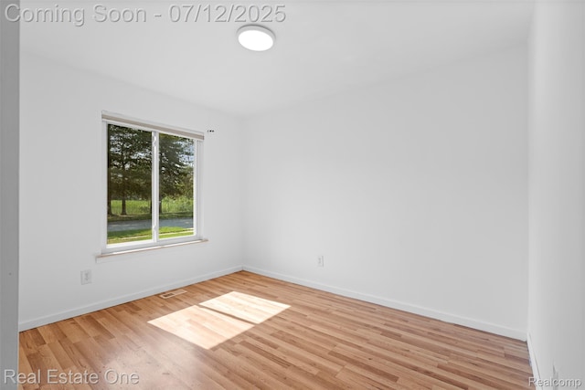15679 Gulley St, Taylor, MI 48180 - empty room with wood finished floors and baseboards