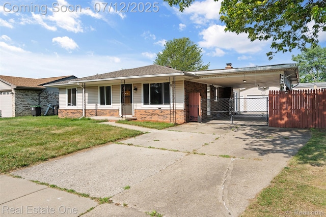 15679 Gulley St, Taylor, MI 48180 - view of front of home with brick siding, a gate, an attached carport, and driveway