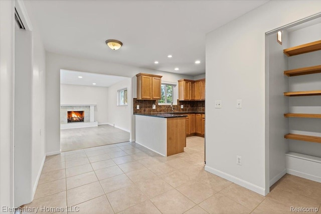 21142 Michael Ct, Saint Clair Shores, MI 48081 - kitchen with backsplash, dark countertops, light tile patterned floors, open floor plan, and recessed lighting